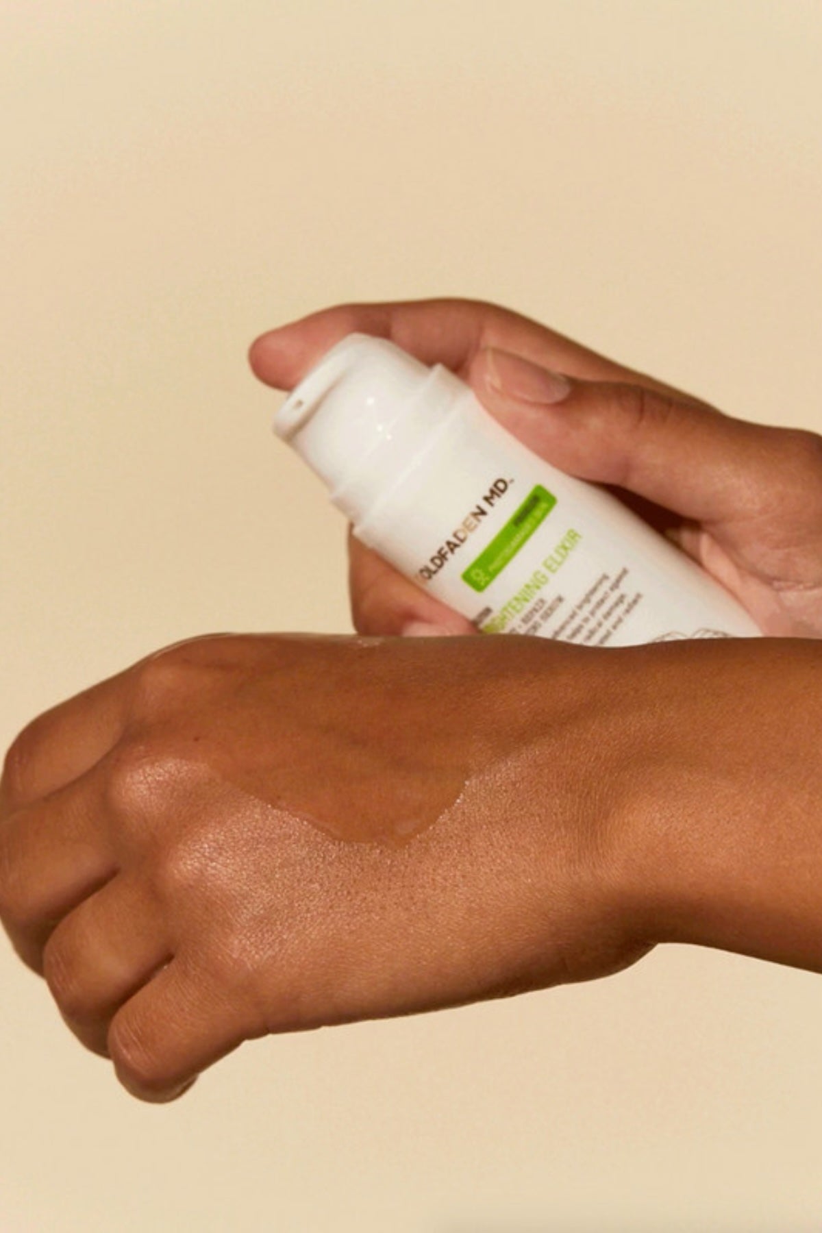 Goldfaden MD Brightening Elixir being applied to the skin