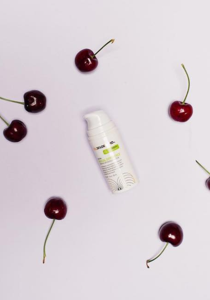 Artistic shot with cherries and Radical Difference product